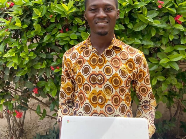 SREF laptop handoff — recipient with his new Acer laptop